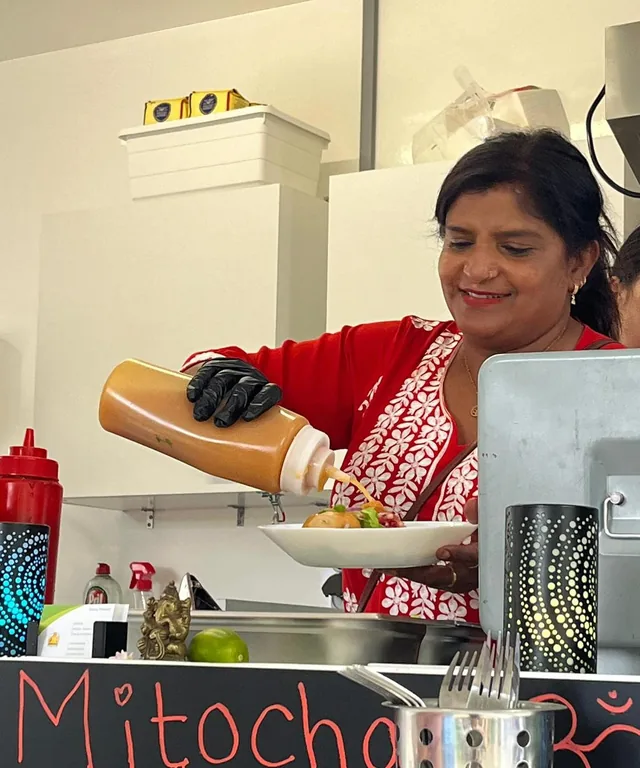Sushma plating a dish